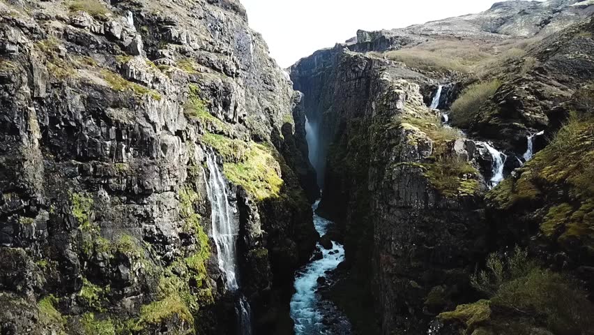 Drone shot of second highest waterfall Glymur in Iceland (Slow Motion)