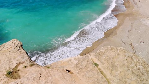Deserted beach with crystal clear water on shores of Mediterranean Sea, aerial view