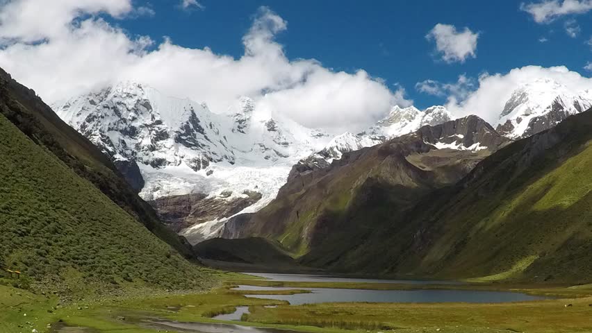 Timelapse huayhuash in peru with snow capped mountains and clouds. Cordillera Andes
