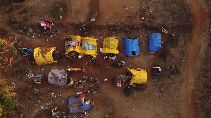 Residential tents of poor people. Aerial view of slums of homeless people and children.