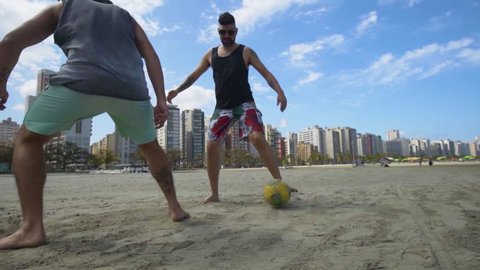 Santos/Brazil - March 2018: Boys Playing Soccer At The Beach In Brazil.
