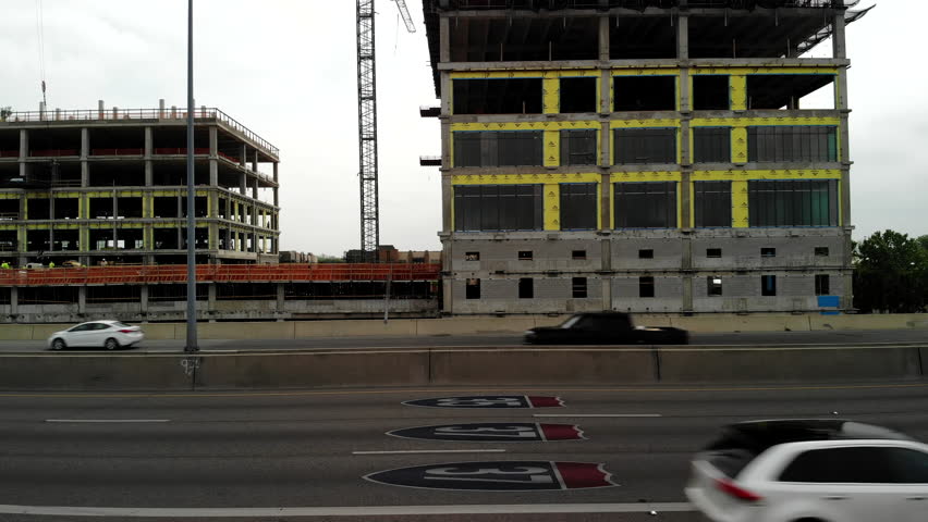 Aerial Shot Hovering and Looking Across the 281 Freeway in San Antonio, Texas with Signs for the 35 and 37 in View