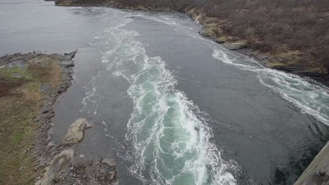 Saltstraumen is a small strait with one of the strongest tidal currents in the world. It is located in the municipality of Bodø in Nordland county, Norway. filmed static shot from above