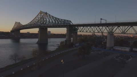 Aerial view of Jacques-Cartier Bridge over the St. Lawrence River at dusk in Montreal, Quebec, Canada