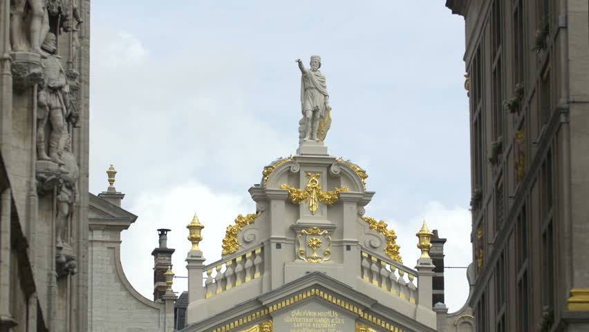 Belgium, Brussels - October, 2016: A building top with a statue and golden details