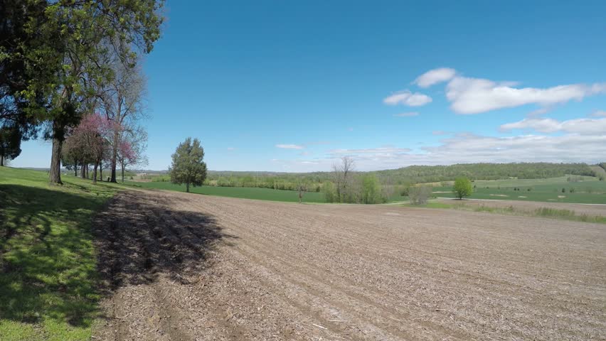 Empty field in western Kentucky under beautiful blue sky