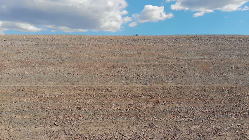 View of a lake at the foot of a volcanic mountain range