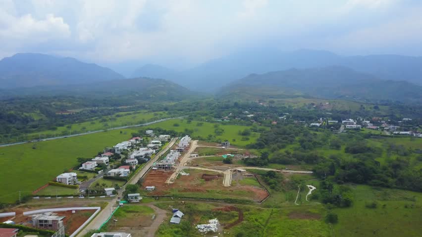 AERIAL: pushing through the cloudy and mountainous terrain of Cali, Colombia..