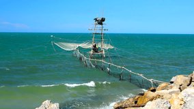 Little fisherman home with white net in the  sea and  blue sky background,4K video resolution.