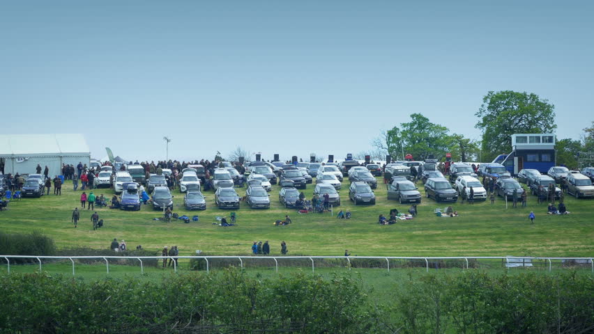Crowd Of People And Cars At Outdoor Event