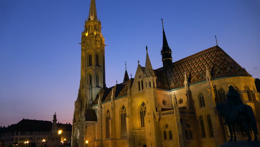 Slow zoom in to a close up shot of the main tower of Matthias Church, Fisherman