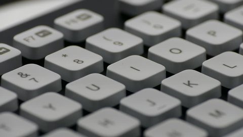 Ungraded: Rotating English PC keyboard around keys with letters, digits and punctuation marks. Ungraded H.264 from camera without re-encoding.