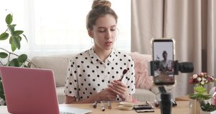Beauty vlogger recording make up tutorial 