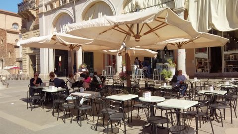 Faenza, Ravenna, Emilia-Romagna, Italy - Apr 27, 2019: Piazza del Popolo (People's Square), the medieval palace, the cathedral. Faenza is famous for the artistic ceramics pottery. 