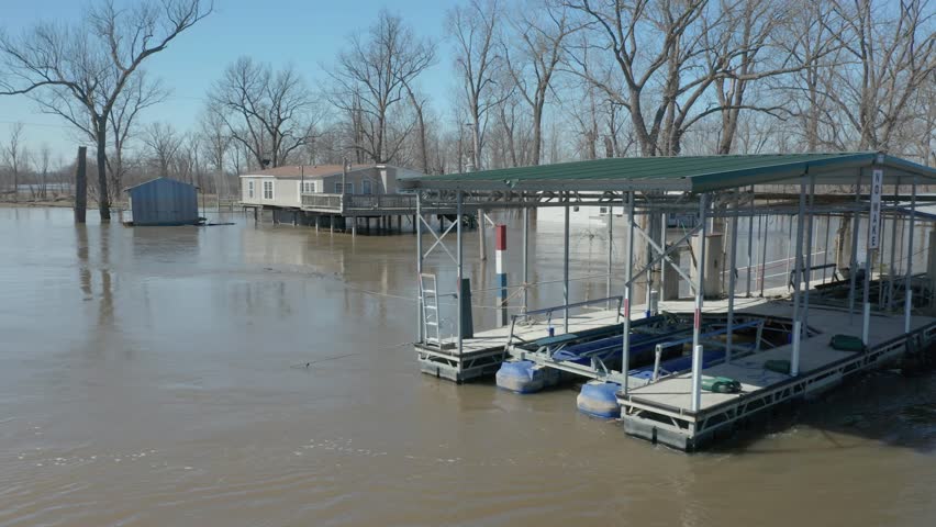 4K flood footage along Mississippi River, state of emergency. Water level high on houses. High bit rate.
