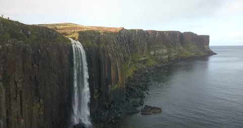 Aerial view of Kilt rock waterfall in Isle of Skye, Scotland. A panement toward the sea shows the size and beauty of this site.