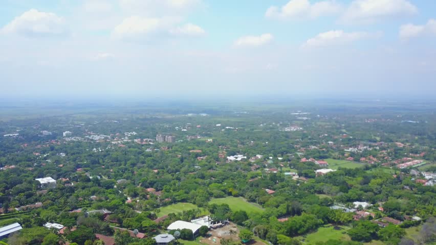 AERIAL: wide and slow push over the suburban section of Cali, Colombia in Cali, Colombia.