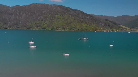 SLOWMO - Aerial shot of sail boats in Queen Charlotte Sound, Marlborough Sounds, South Island, New Zealand