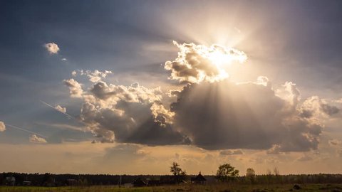 Timelapse of sun rays emerging through fluffy clouds, trust and hope, heaven