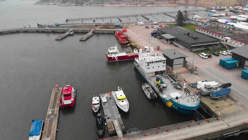 Aerial footage over harbour in Alvsborg, Gothenburg, Sweden. Showing lots of boats, coast guard and rescue boats.
