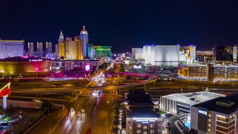 Las Vegas, Nevada / USA - April 9th 2019: Aerial view of hotels and casinos on the Las Vegas strip from above at night with freeway traffic.