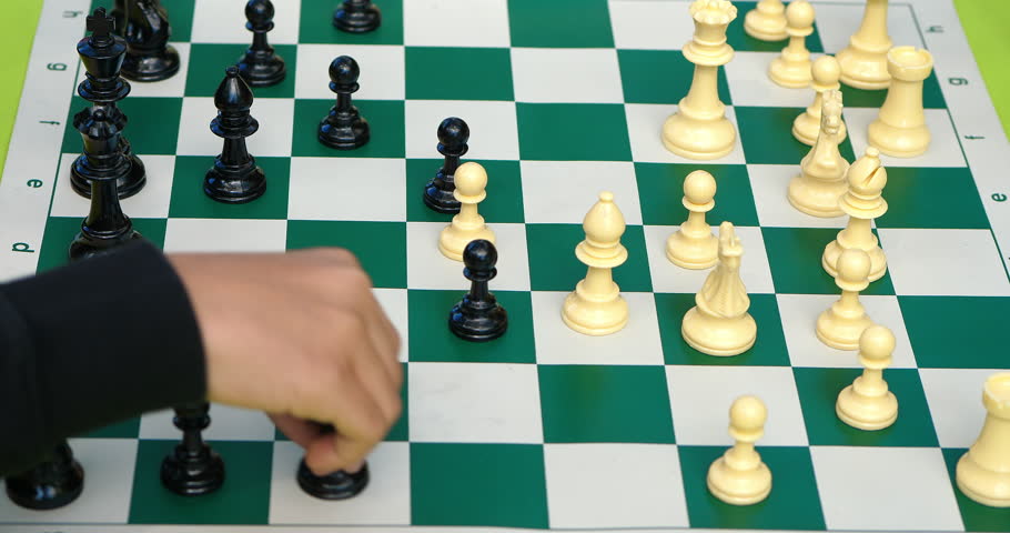 Young boys play chess battle with coming checkmate, 4K