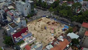 Drone flight over massive residential building construction sites in Ho Chi Minh City, Vietnam - 4K aerial video