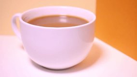 Close Up Of White Cup Of Bleached Coffee