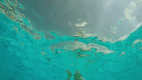 Slow motion video: swimmer underwater 