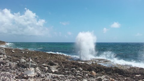 Grand Cayman, East End, Surf pounds up through blowhole