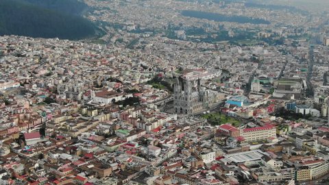 Aerial over the city of Quito, telephoto shot of the Metropolitan Cathedral