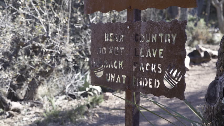 Old rusty Bear Country warning sign in the Big Bend National park, Texas