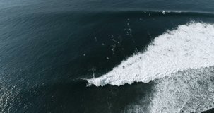 Aerial view of surf line up in tropical place. El Salvador wave at Punta Roca, La Libertad. SLOW MOTION footage of beach lifestyle and surf.