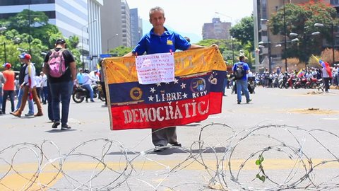 Caracas/Venezuela, May 1, 2019: Workers claims for higher salaries and the resignation of Nicolas Maduro on international working day in Caracas, Venezuela