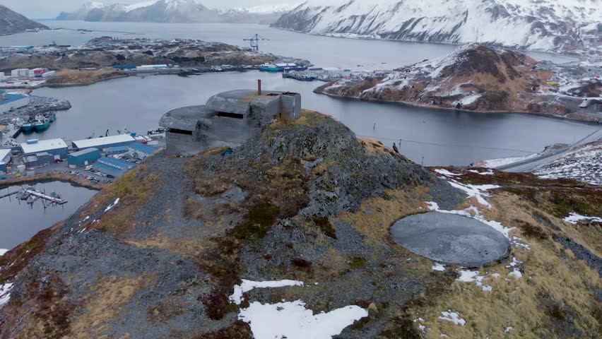 Aerial panorama view of circling around old world war II bunker on Dutch Harbor island Alaska