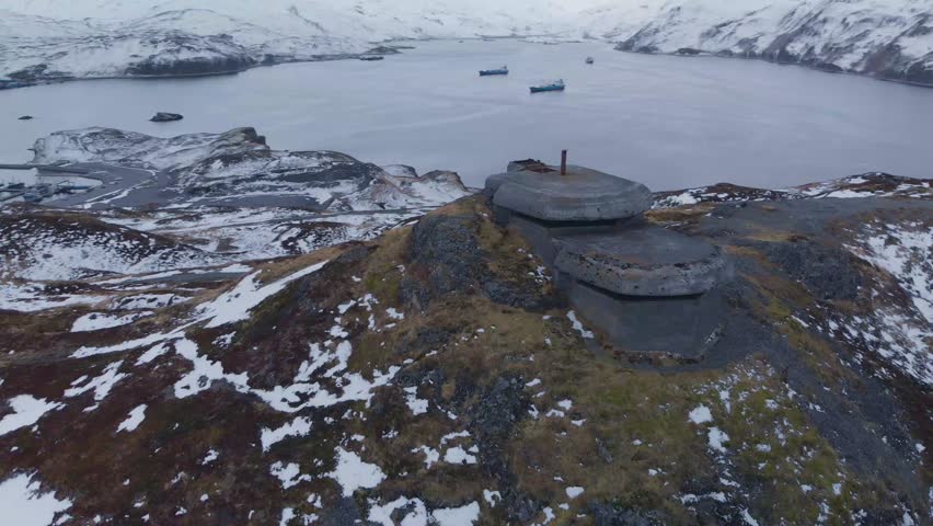 Aerial panorama view of circling around old world war II bunker on Dutch Harbor island Alaska