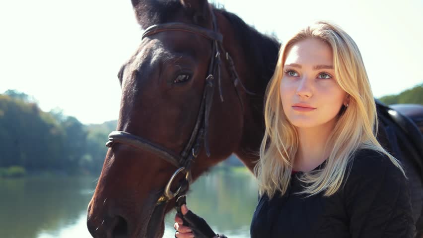 Young woman with a horse
