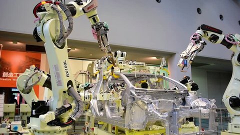 Nagoya / Japan - February 10th 2018: Robots assembling a car at Toyota Commemorative Museum of Industry and Technology