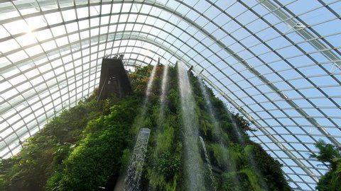 Marina Bay/Singapore - 4 May 2019: Low Angle Shot of the indoor waterfall at the Cloud Forest Dome at Gardens by the Bay Singapore