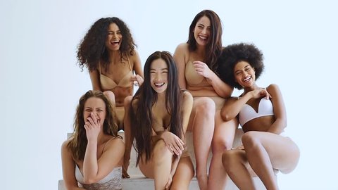 Group of multi ethnic women with different kind of beauty and body, posing and having fun in a studio. concept about women and femininity