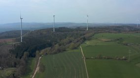 Close up with pan to the left of Windmills by Mengeringhausen in Hessen Germany