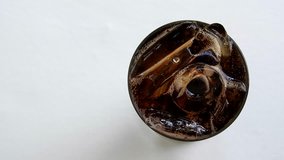 Top view cola in glass with ice cube and bubble fizzy,cola in glass with ice and bubble clips