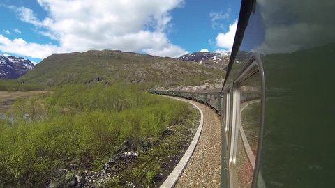 View of Flamsbana Rail Car (Flam Train) Curving Around Breathtaking Mountains in Norway
