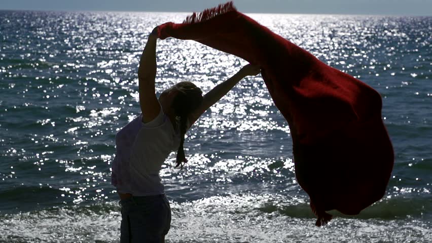 Beauty happy joyful silhouette of an adult woman enjoying nature outdoors, raising her hands. Happy free man