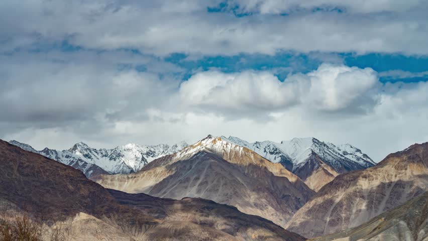 4K Timelapse of beautiful landscape with snow mountain background this way go to Nubra Valley, Leh Ladakh, India Royalty-Free Stock Footage #1028956697
