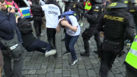 BRNO, CZECH REPUBLIC, MAY 1, 2019: Conflict of radical extremists and activist man against radicalism, extremists. National Social Front. Police and policeman helmet riot intervene and suppress fight