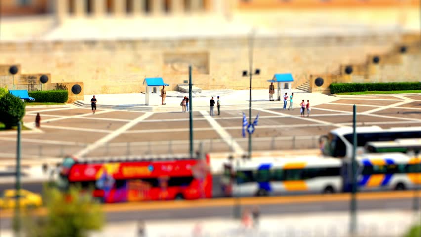 The monument of the unknown soldier in the Syntagma central square of Athens, Greece, in front of the parliament house. Shot as a time lapse with a tilt shift miniature effect.