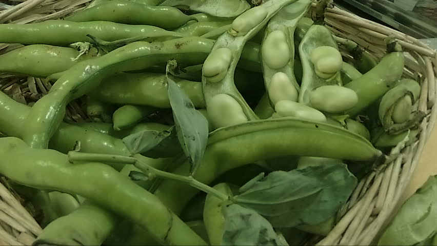 Close up fresh broad beans peeled in a basket