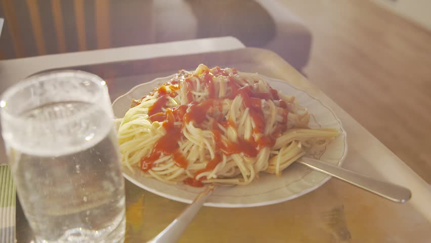 Spaghetti and meat with ketchup to lunch | Shutterstock HD Video #1028986475
