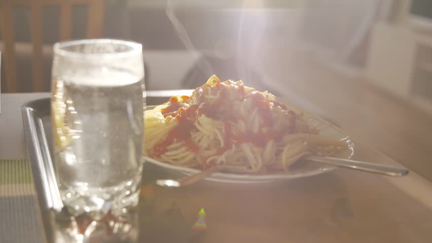 Smoking hot Spaghetti on plate in sunshine | Shutterstock HD Video #1028986502